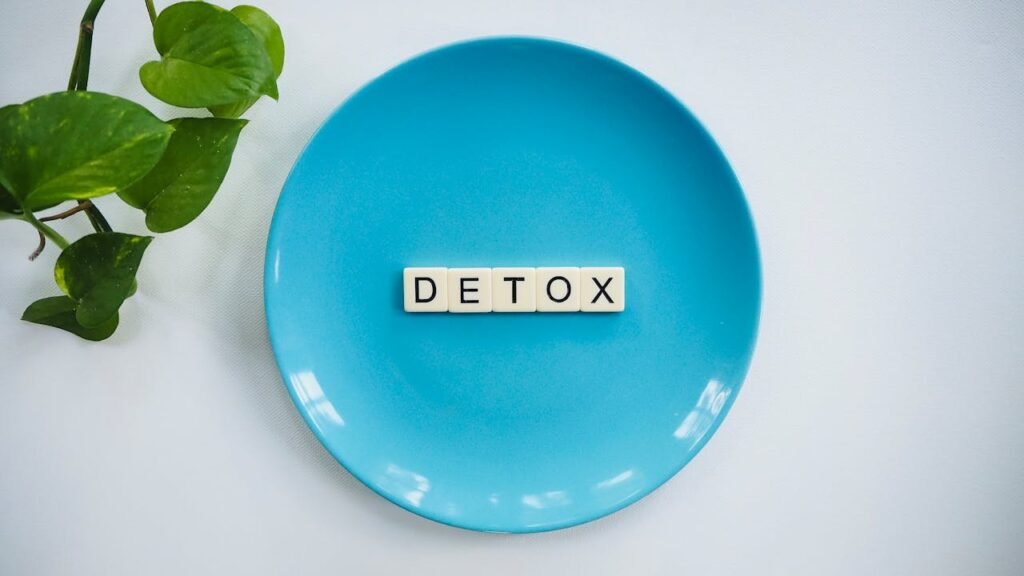 blue plate with the word "detox" spelled out in scrabble like blocks