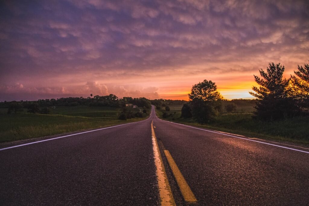 photo of a road vanishing at a point in the distance